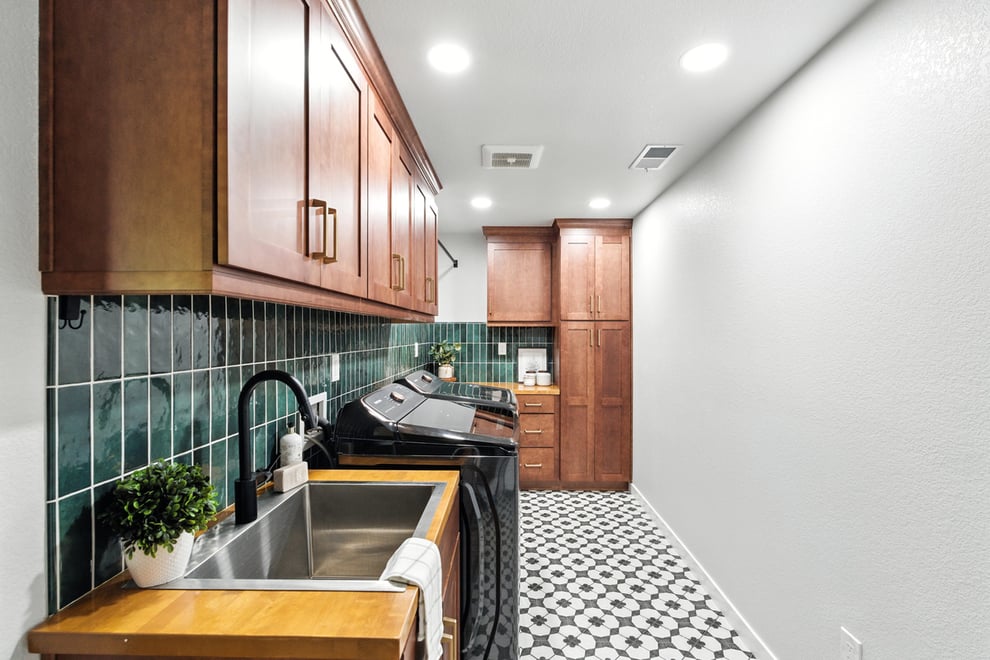 Fresno Mudroom with statement tile floor and backsplash and ample custom cabinets