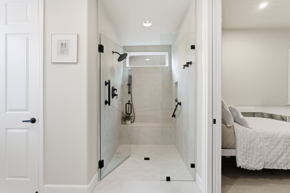 Walk-in shower with safety features and seating in in-law suite in Fresno, CA