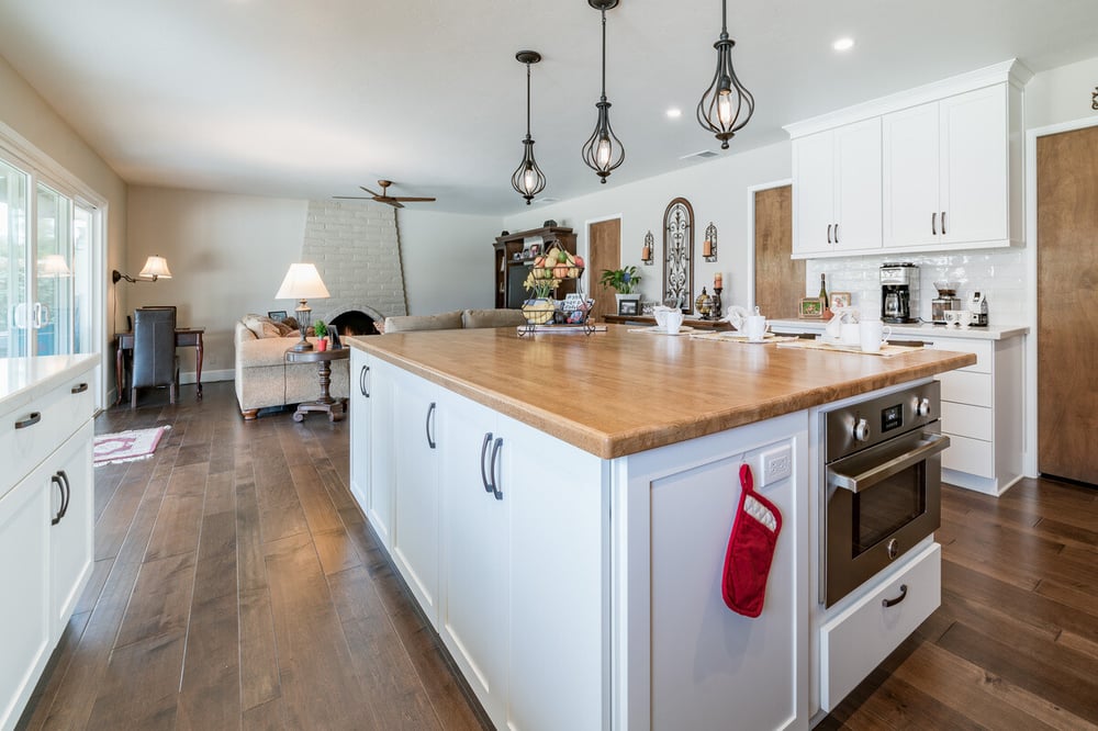 Island with cabinets and microwave in Fresno kitchen by Imagine Remodeling