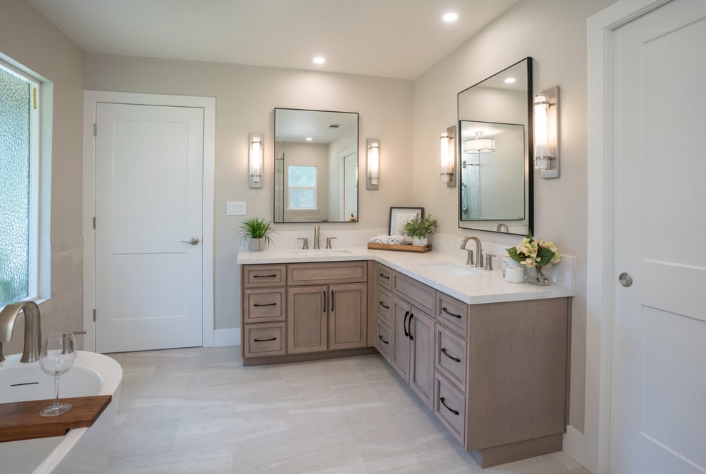 Luxury bathroom remodel in Fresno with double L-shaped vanity by Imagine Remodeling