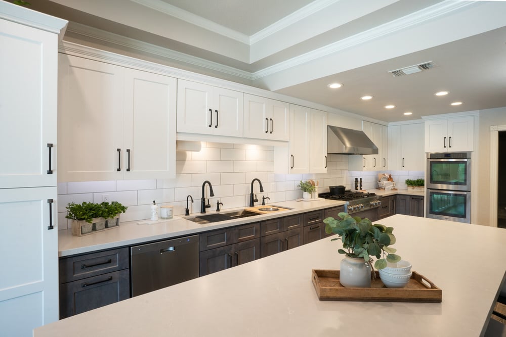 Two-tone kitchen remodel with island by Imagine Remodeling