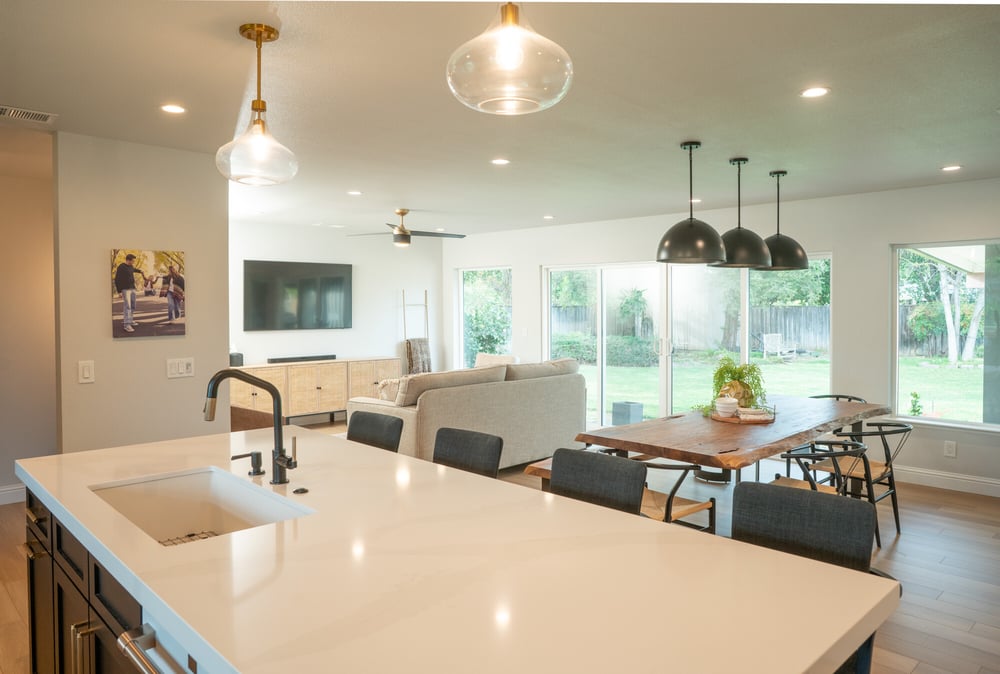 View of first floor from kitchen island with sink in Fresno home remodel by Imagine Remodeling