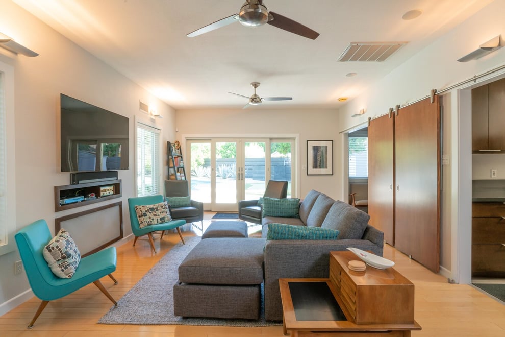 Fresno, CA living room design with couches and chairs by Imagine Remodeling