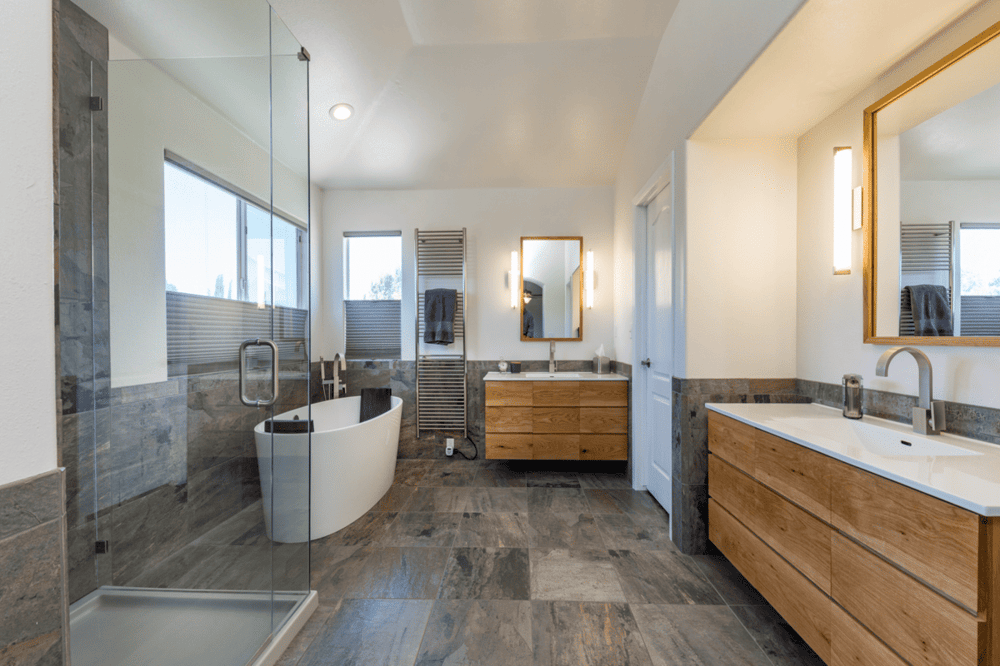 High-end bathroom remodel with freestanding tub and walk-in shower in Fresno by Imagine Remodeling