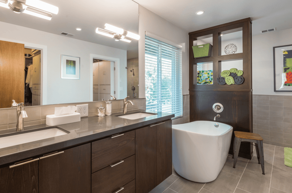 Double vanity and freestanding tub in Fresno, CA bathroom remodel by Imagine Remodeling