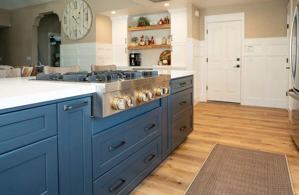 Stove top on kitchen island with storage in Fresno by Imagine Remodeling