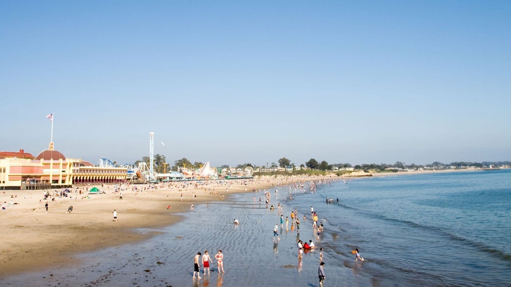 Santa Cruz Beach shoreline on sunny day with people