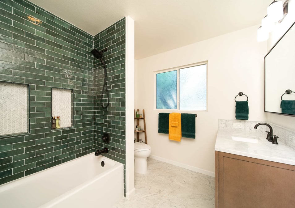 Small bathroom remodel with green subway tile by Imagine Remodeling in Fresno, CA