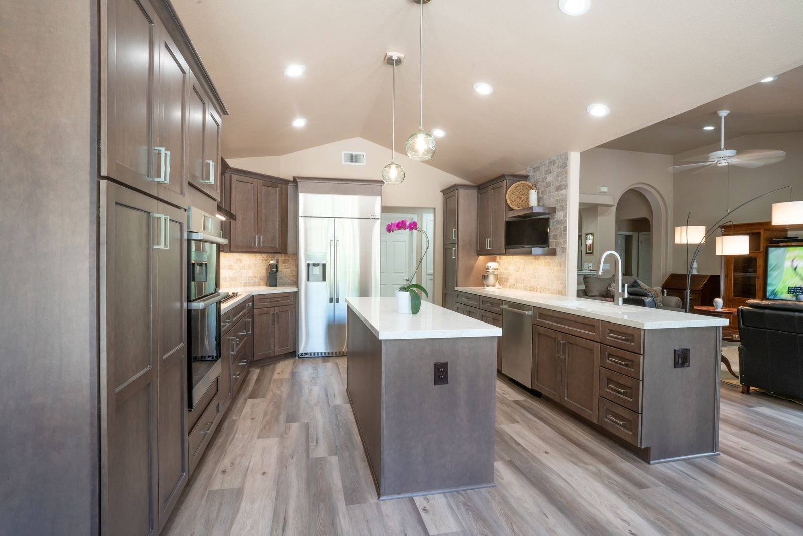 design build kitchen remodel with recessed lighting and kitchen island in fresno