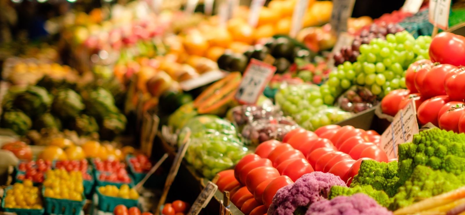 farmers market in clovis california with a row of fruits and vegetables