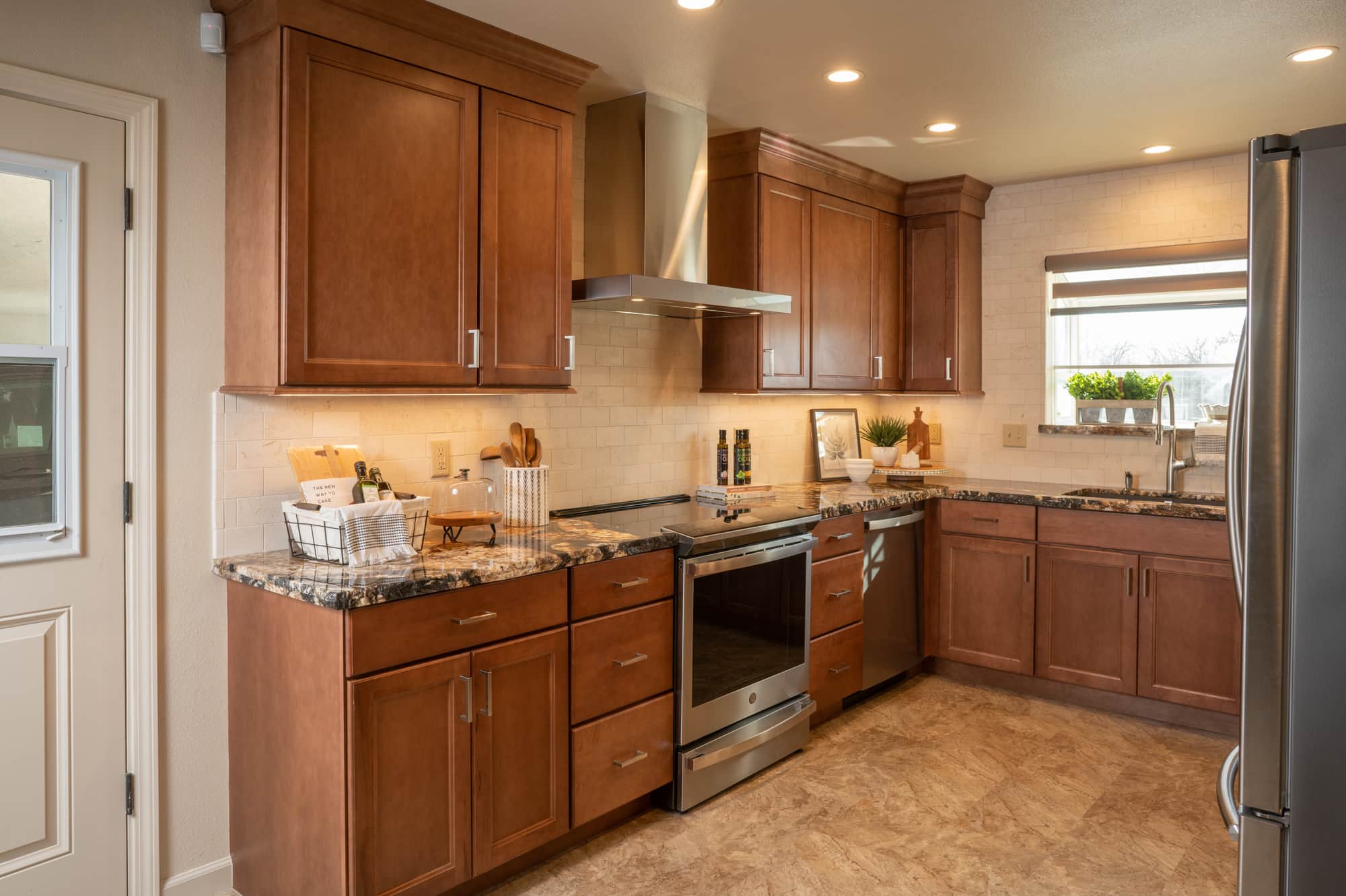 fresno masculine kitchen design with dark cabinets and range hood