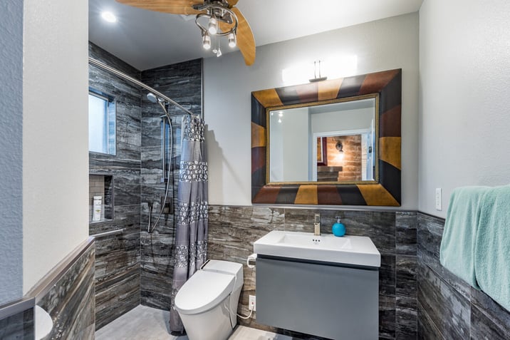 modern bathroom remodel with floating vanity and stone tile in fresno (1)