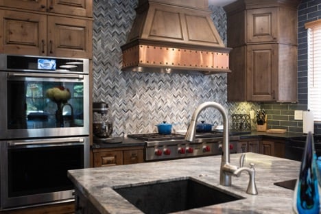 rustic kitchen with brass range hood in fresno california