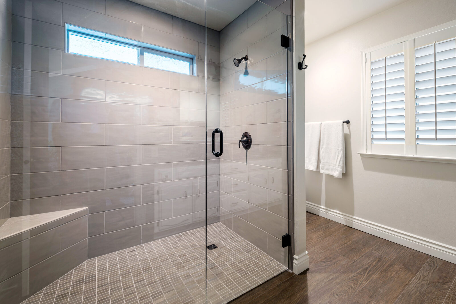 tile walk in shower with sitting ledge in fresno bathroom remodel