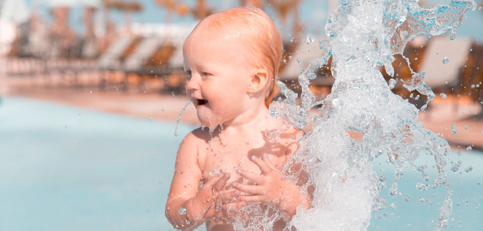 wildwater adventure park in clovis with kid standing on water spray (1)